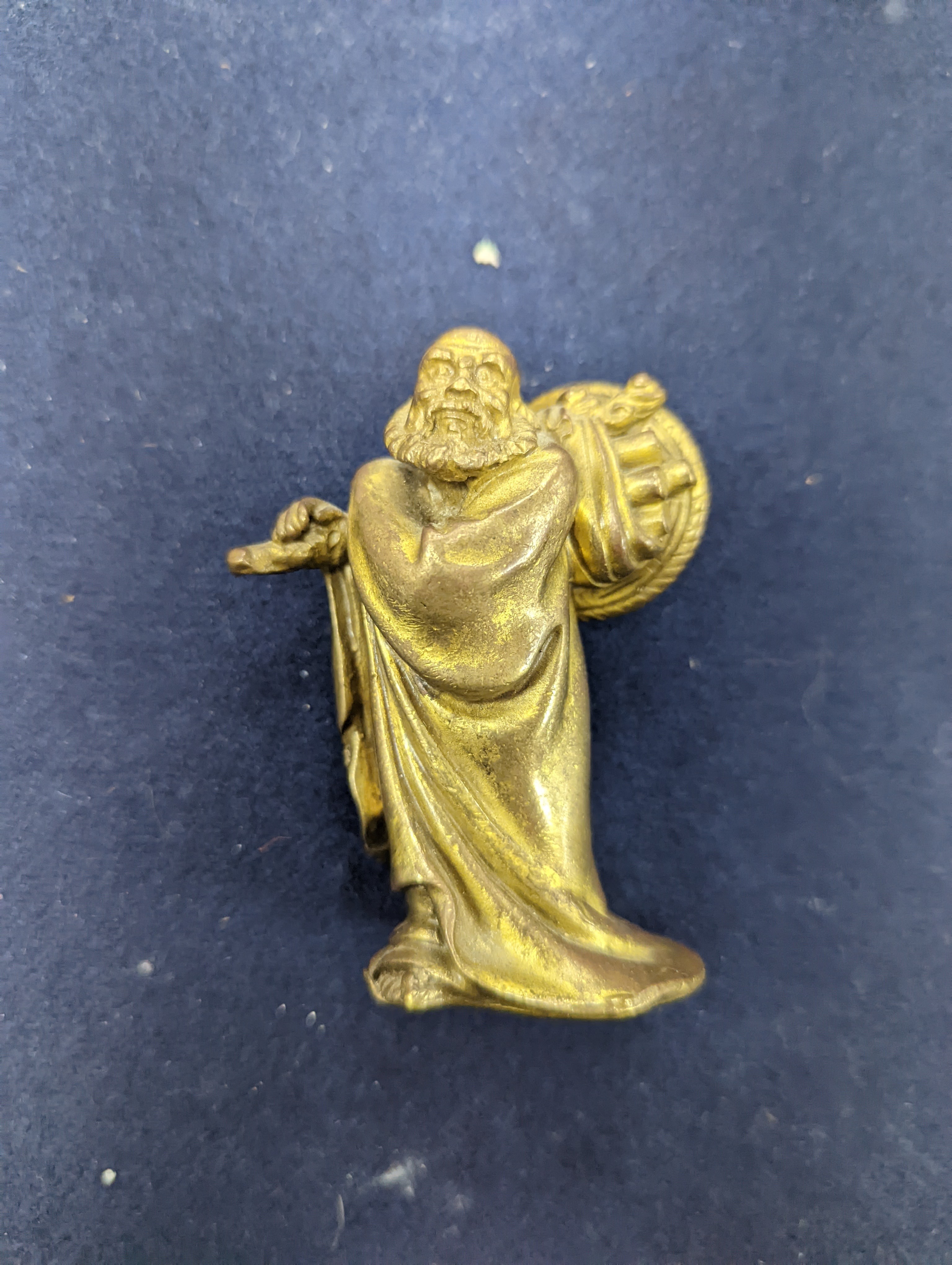 A Chinese gilt copper figure, a Chinese Dog of Fo, a bell, a censer, six Indian bronze figures and a scroll box